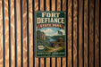 A vintage-style metal sign for Fort Defiance State Park, featuring a scenic image of the park and its surroundings.