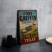 A vintage-style metal sign for Fort Griffin, a historic site in Texas, featuring an illustration of a building and a wagon train.