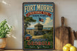 A vintage-style sign for Fort Morris Historic Site in Georgia, featuring a wooden fence, a lighthouse, and a palm tree, with the text "Step into History Georgia" and "Explore. Learn. Preserve."