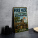 A vintage-style metal sign for Fort Mose Historic State Park, featuring a cannon and a wooden fence, with a Florida state seal and the year 1738.
