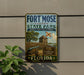 A vintage-style sign for Fort Mose Historic State Park in Florida, featuring a cannon, a wooden fence, and a flag.