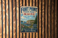 A vintage metal sign for Fort Point State Park in Maine, featuring a scenic illustration of the park and its surroundings.