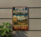 A vintage-style metal sign for Fort Robinson State Park in Nebraska, featuring a historical image of a building and a cannon.