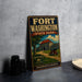 A vintage-style metal sign for Fort Washington State Park in Pennsylvania, featuring an illustration of a cannon and a castle.