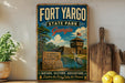 A vintage-style sign for Fort Yargo State Park in Georgia, featuring a scenic illustration of the park's natural and historic attractions.