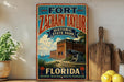 A vintage-style sign for Fort Zachary Taylor Historic State Park in Florida, featuring a cannon and a tropical landscape.