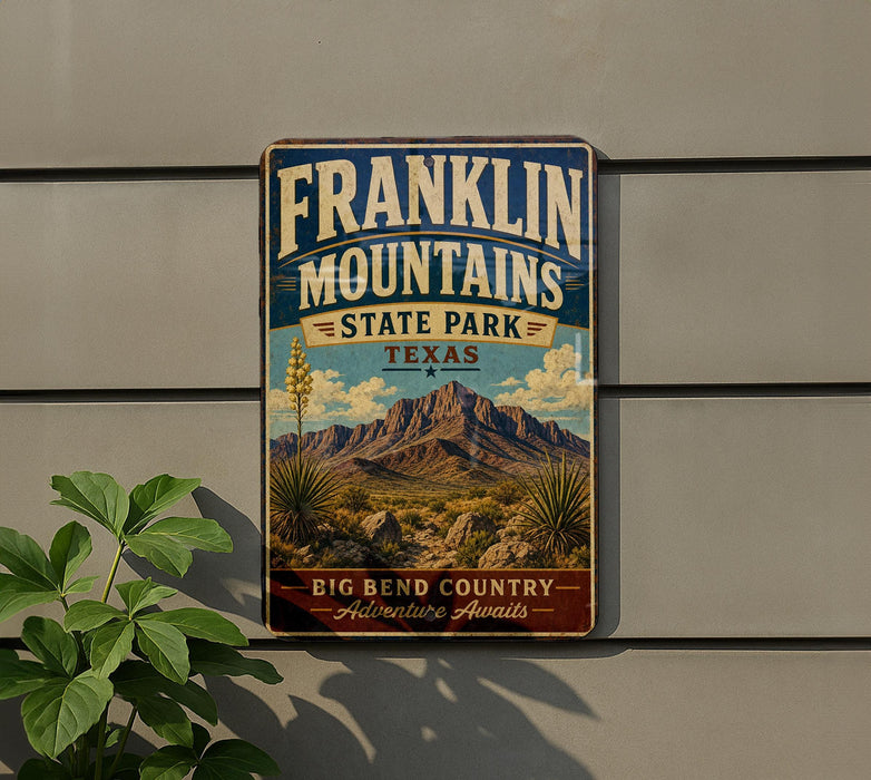 A vintage Franklin Mountains State Park sign is displayed on a wall, featuring a scenic illustration of the park's landscape with mountains, desert, and desert plants.