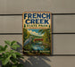 A vintage-style sign for French Creek State Park in Pennsylvania, featuring a scenic illustration of a river, bridge, and wildlife.