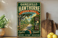 a vintage-style metal sign for the Gainesville-Hawthorne State Trail in Florida, with a scenic illustration of a road surrounded by trees and greenery. The sign encourages visitors to explore nature, history, and adventure.