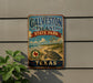 A vintage-style metal sign for Galveston Island State Park in Texas, featuring a turtle and beach scene.