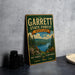 A vintage-style metal sign for Garrett State Forest, Maryland, featuring a scenic landscape with pine trees, a lake, and mountains.
