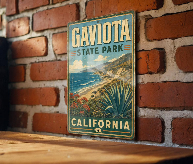 A vintage-style metal sign for Gaviota State Park in California, featuring a scenic landscape with mountains, cliffs, and a desert landscape.