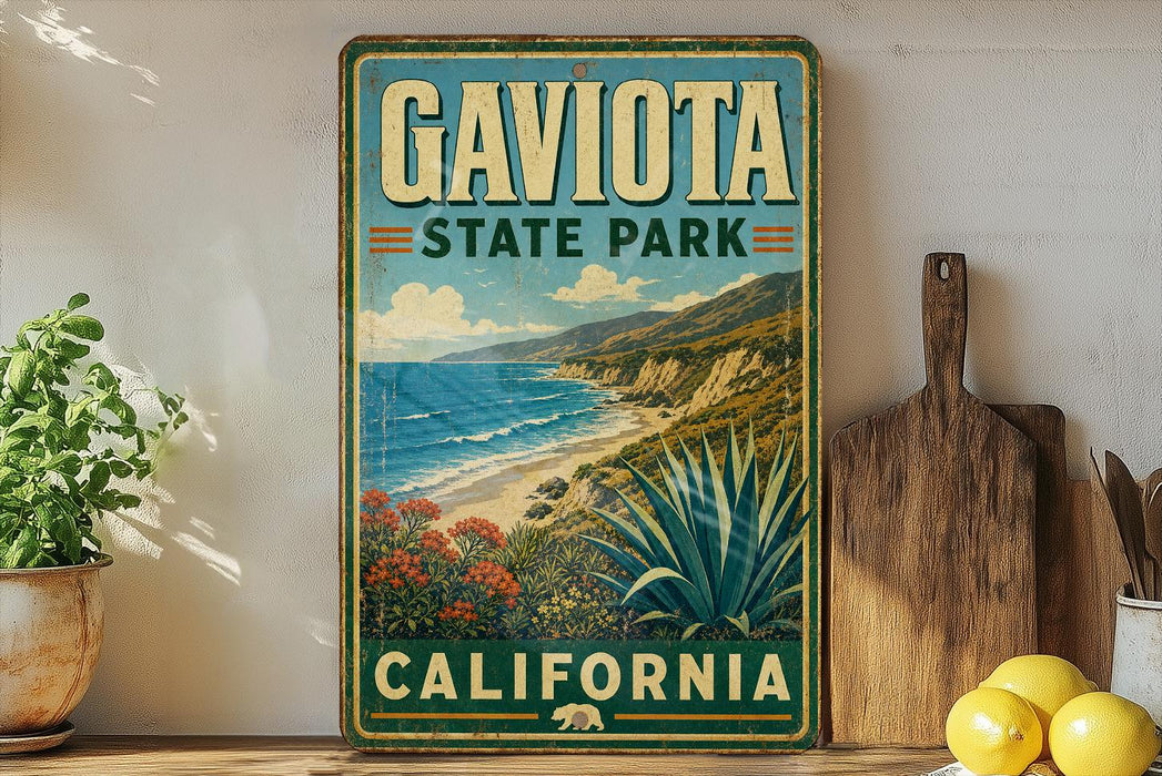 A vintage-style metal sign for Gaviota State Park in California, featuring a scenic coastal landscape with mountains, ocean, and desert vegetation.