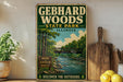 A vintage-style metal sign for Gebhard Woods State Park in Illinois, featuring a scenic illustration of a river and forest.