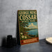 A vintage-style metal sign for George Payne Cossar State Park in Mississippi, featuring a scenic illustration of a lake, trees, and a canoe.