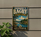 A vintage-style metal sign for George T. Bagby State Park in Georgia, featuring a scenic landscape with a lake, trees, and a bridge.