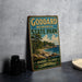 A vintage-style metal sign for Goddard Memorial State Park, featuring a scenic landscape with a beach, mountains, and a lighthouse.