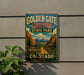 A vintage-style sign for Golden Gate Canyon State Park in Colorado, featuring a scenic mountain landscape with a dirt road leading through it.