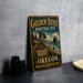 A vintage-style metal sign for the Golden State Heritage Site in Oregon, featuring a scenic landscape with a cabin, mountains, and a flag.