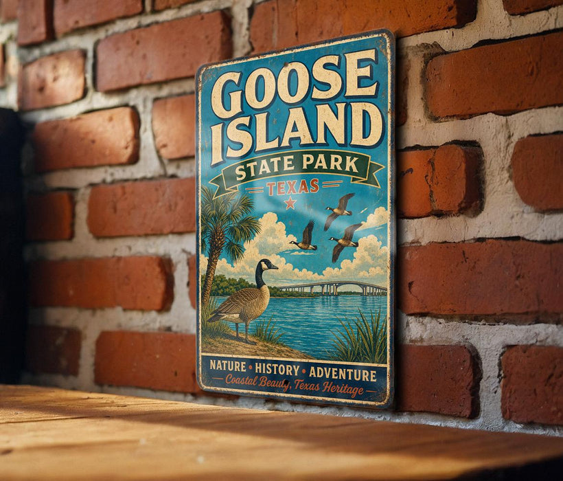 A vintage-style metal sign for Goose Island State Park in Texas, featuring a goose and palm trees, is mounted on a brick wall.