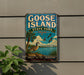 A vintage-style metal sign for Goose Island State Park in Texas, featuring a palm tree, birds, and a body of water.