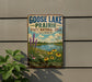 A vintage-style sign for Goose Lake Prairie, Illinois, featuring a scenic landscape with a lake, flowers, and a blue sky with clouds.