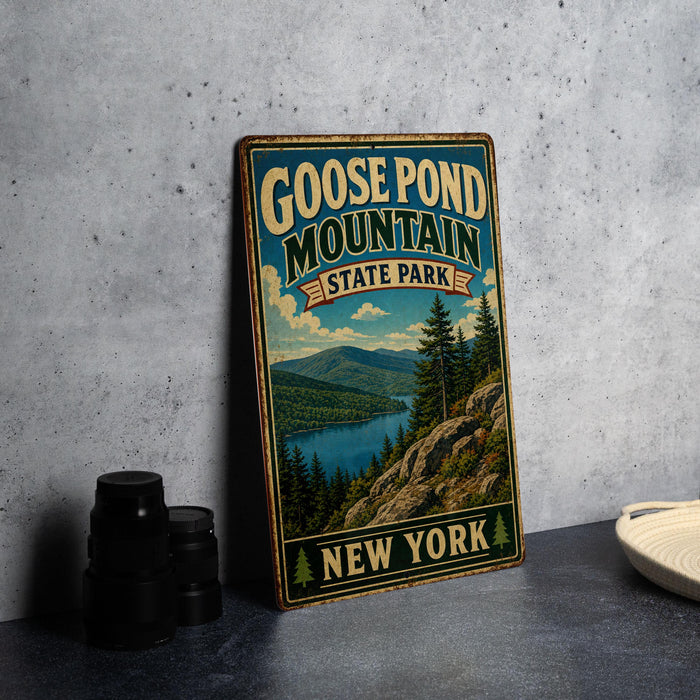 A vintage-style sign for Goose Pond Mountain State Park in New York, featuring a scenic mountain landscape with pine trees and a lake.