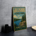 A vintage-style metal sign for Goudsboro State Park in Pennsylvania, featuring a scenic landscape with a lake and pine trees.