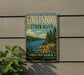 A vintage-style metal sign for Gouldsboro State Park in Pennsylvania, featuring a scenic landscape with a lake, mountains, and pine trees.