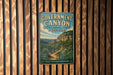 A vintage-style metal sign for Government Canyon, a state natural area in Texas, mounted on a wooden wall.