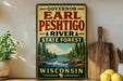 A vintage-style sign for "Governor Earl Peschigo River State Forest Wisconsin" is displayed on a shelf, with a potted plant and a wooden cutting board nearby.