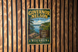 A vintage-style metal sign for Governor Nelson State Park in Wisconsin, featuring a scenic landscape with a lake and mountains.