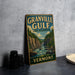 A vintage-style sign for the Granville Gulf State Reserve in Vermont, featuring a scenic illustration of a river and mountains.