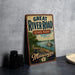 A vintage-style metal sign for the Great River Road State Park in Mississippi, featuring a scenic illustration of a river, trees, and a steamboat.