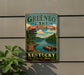 A vintage-style sign for Greenbo Lake State Resort Park in Kentucky, featuring a scenic image of the lake and surrounding landscape.