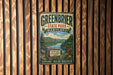 A vintage metal sign for Greenbrier State Park, Maryland, featuring a scenic landscape with mountains, lakes, and a cabin.
