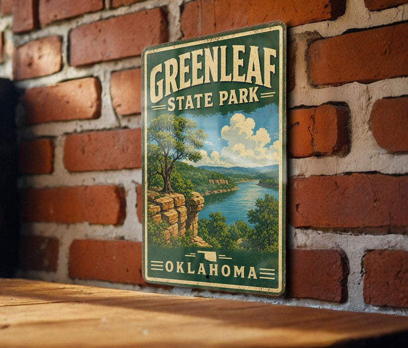 A vintage-style metal sign for Greenleaf State Park in Oklahoma, featuring a scenic landscape with a river and mountains.
