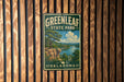 A vintage-style metal sign for Greenleaf State Park in Oklahoma, featuring a scenic landscape with a river, cliffs, and trees.