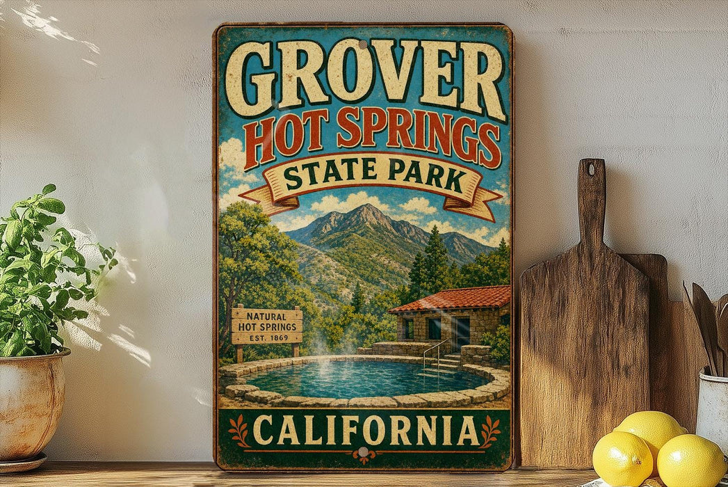 A vintage-style sign for Grover Hot Springs State Park in California, featuring a scenic illustration of the hot springs and mountains.