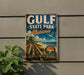A vintage-style metal sign for Gulf State Park, Alabama, featuring a beach scene and a wooden walkway.