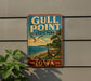 A vintage metal sign for Gull Point State Park in Iowa, featuring a scenic landscape with a beach, mountains, and a seagull in flight.