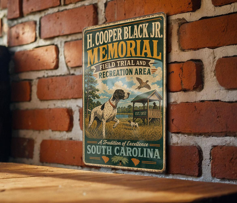 A metal sign with a vintage design hangs on a brick wall, featuring a dog and a bird in a field.