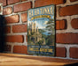A vintage-style metal sign for Ha Ha Tonka State Park in Missouri, featuring a castle and a scenic landscape.