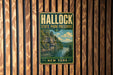 A vintage metal sign for Hallock State Park Preserve in New York, featuring a scenic landscape with a river and mountains.