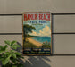 A vintage-style sign for Hamlin Beach State Park in New York, featuring a beach scene with a tree, grass, and water.