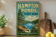 A vintage-style metal sign for Hampton Ponds State Park in Massachusetts, featuring a scenic landscape with a lake, trees, and mountains.
