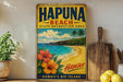 A vintage-style metal sign for Hapuna Beach, Hawaii, featuring a tropical beach scene with palm trees, flowers, and a blue ocean.