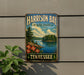 A vintage-style sign for Harrison Bay State Park in Tennessee, featuring a scenic landscape with a lake, trees, and flowers.
