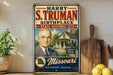 A vintage-style metal sign featuring a portrait of a man, with text indicating that he was born in a little house in Missouri.