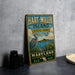 A vintage-style metal sign for Hart-Miller Island State Park in Maryland, featuring a large blue heron and a scenic landscape.